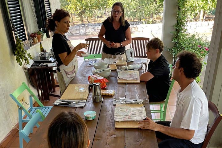Hands in dough between orecchiette and focaccia in nature — photo 1 of 20