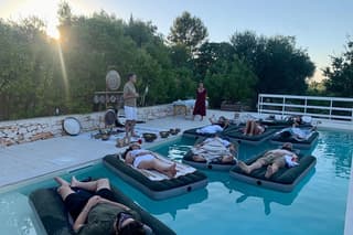 Floating sound bath at sunset Agape Gardens Of Agape