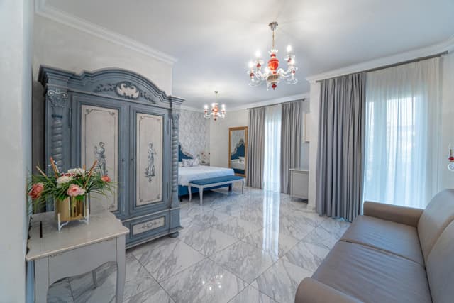 Deluxe Quadruple Room with Balcony