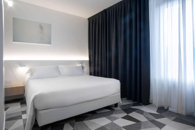 Deluxe Room with One Queen Bed and One Single Bed