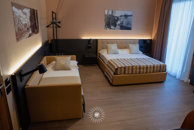 Superior Triple Room With Balcony and Partial Lake View