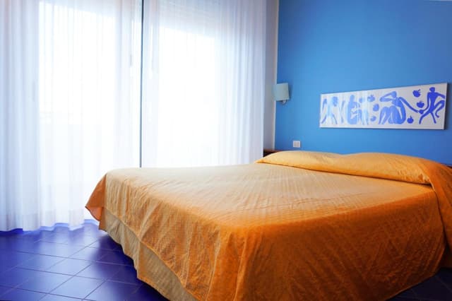 One-Bedroom Apartment with Balcony and Lateral Sea View