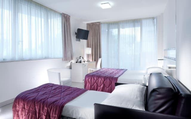 Superior Double Room with Sofa Bed and Balcony with Side Sea View