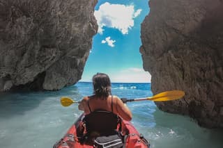 Kayaking excursion in Porto Miggiano among the sulfur caves