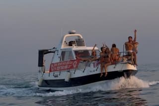 Aperitif in boat at sunset Scoglitti province of Ragusa